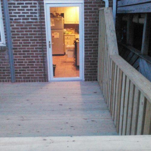 Entrance to the apartment kitchen with wooden walkway