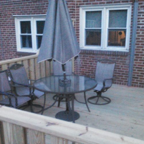 Wooden deck with tables and chairs
